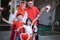 Family decorating bicycle with flag and bow for indonesia independence day