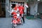 Family decorating bicycle with flag and bow for indonesia independence day