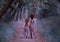 Family of deer are walking in the forest, fauns mother and daughter are walking along a mysterious path to the forest in