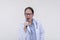 A family doctor singing with a microphone during a karaoke session after work. Of asian descent, middle aged male in his 40s.