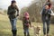 Family and dog on country walk in winter