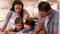 Family drawing together in kitchen