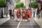Family dressed as Romans of the imperial era walking through the streets
