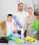 Family dressed for cleaning, standing