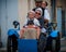 Family dressed for heritage day on a vintage blue Three wheeler