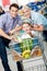 Family drives cart with food and son sitting there