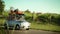 Family driving in a small car toward summer holiday on beach