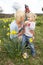 Family On Easter Egg Hunt In Daffodil Field