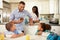 Family Eating Breakfast At Home Together