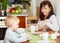 Family eating corn flakes and bread breakfast meal at the table