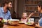 Family eating an dinner at a dining table