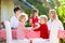 Family eating outdoor. Garden summer fun