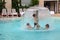 Family enjoy together in thermal pool