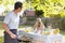 Family Enjoying A Barbeque