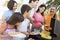 Family Enjoying A Barbeque