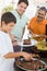 Family Enjoying A Barbeque