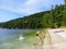 A family enjoying the beautiful beaches and admiring the pretty ocean view of Galiano Island in Montague Harbour, British Columbia