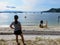 A family enjoying the beautiful beaches and admiring the pretty ocean view of Galiano Island in Montague Harbour, British Columbia