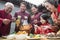 Family enjoying Chinese meal in traditional Chinese clothing