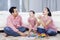 Family enjoying leisure time in the living room