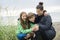 Family enjoying the rain and having fun outside on the beach a gray rainy