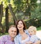 Family enjoying their leisure having a picnic in the park