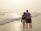 Family enjoying time together on beautiful foggy beach.