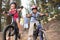 Family enjoying walk in the countryside with bikes