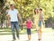 Family Enjoying Walk In Park