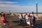 A family enjoys a walk along the Boardwalk