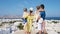 Family in Europe. Parents and kids background the old town in Mykonos island, Greece