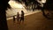 Family evening walk along the sea. Father mother and daughter go holding hands