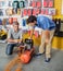 Family Examining Air Compressor In Store