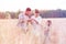 Family examining wheat crops