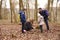 Family exploring nature together in a wood