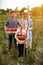 Family on farm with pick tomatoes