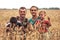 Family farmers with children recreation in rural wheat field countryside lifestyle family portrait