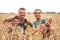 Family farmers with children recreation in rural wheat field countryside lifestyle family portrait