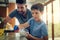 Family, father and son cleaning the kitchen counter, development and growth at home. Parent, male child and dad with kid