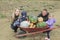 A Family on a field with pumpkins background