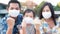 Family fighting Covid-19 Concept.father mother and daughter wearing  face mask for protect corona virus and stay at home