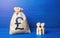 Family figurines and british pound sterling money bag. Investment in human capital. Income, expenses. Refugees crisis. Favorable