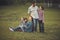 A family of five in the summer in the Park. bearded man and his wife with red hair with three children. happy family