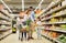 Family with food in shopping cart at grocery store