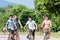 Family of four on bike tour in summer