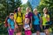 Family with four kids hiking in the mountains