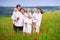 Family with four kids in poppy flower field