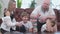 Family of four people playing in board game, wooden tower