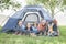 Family Of Four Smiling In Tent