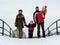 Family of four on winter bridge